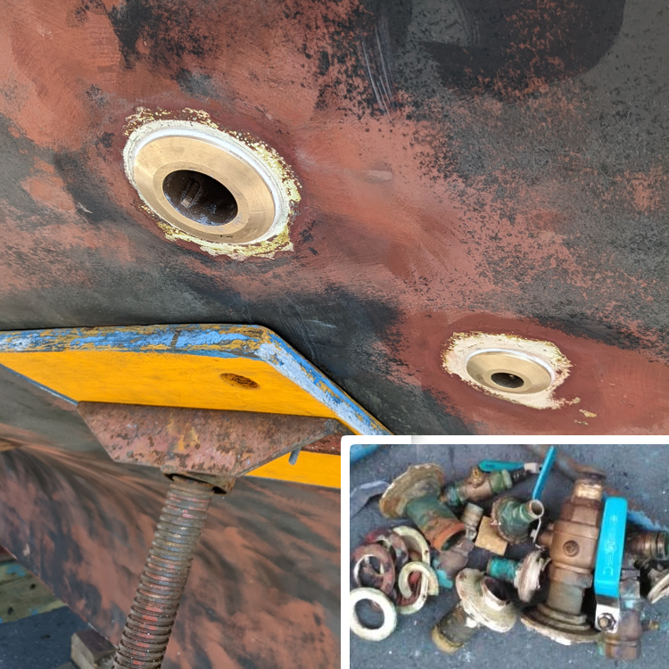 The intentional holes in the hull, through-hulls, are a common cause of sinking when they fail. A friend helped me cut out the old ones (inset) with a holesaw. I glassed in new G10 backing plates to replace the wood ones and installed the new through-hulls with 3M sealant.