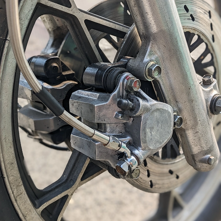 The single front brake barely stopped my bike. I swapped the entire front end with one from a similar model that had dual disc brakes. Dual brakes necessitated replacing the front master cylinder with one that supported two hydraulic lines.
