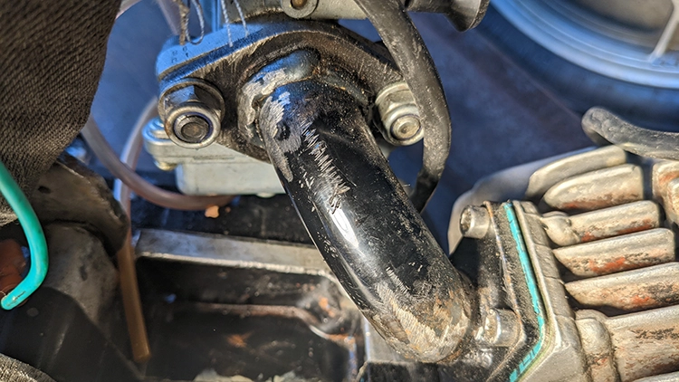 I cut up an intake and welded it back together to angle to the left side instead of the right, to avoid interfering with the exhaust chamber.