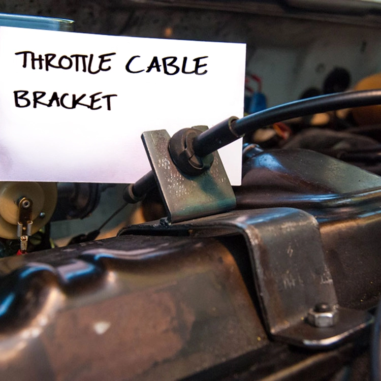 I fabricated this simple bracket to route the old throttle cable to the new carburetor at the correct angle.